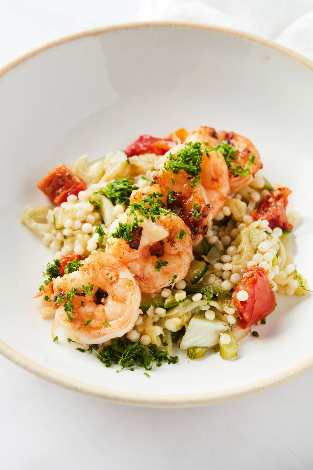 Parelcouscous met scampi, venkel en courgette